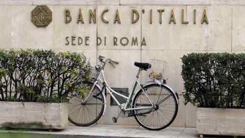 A bicycle is parked in front of a Bank of Italy sign in Rome...A bicycle is parked in front of a Bank of Italy sign in Rome October 31, 2013. Employees of Italian banks went on strike to protest against a decision by the country's biggest lenders to scrap a national labour contract, covering more than 300,000 workers. 
REUTERS/Alessandro Bianchi (ITALY - Tags: BUSINESS EMPLOYMENT CIVIL UNREST)