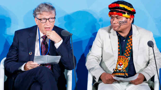 Mandatory Credit: Photo by JUSTIN LANE/EPA-EFE/Shutterstock (10421665cu) Bill Gates (L), a trustee and Co-Chair of the Global Commission on Adaptation, speaks as Amazon-based Indigenous leader Tuntiak Katan (R) listens during the 2019 Climate Action Summit which is being held ahead of the General Debate of the General Assembly of the United Nations at United Nations Headquarters in New York, New York, USA, 23 September 2019. World Leaders have been invited to speak at the event, which was organized by the United Nations Secretary-General Antonio Guterres, for the purpose of proposing plans for addressing global climate change. The General Debate of the 74th session of the UN General Assembly begins on 24 September. United Nations 2019 Climate Action Summit, New York, USA - 23 Sep 2019