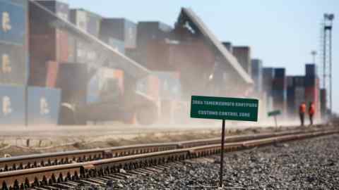 Reach stackers move shipping containers beside a railway track displaying a sign reading 'Customs Control Zone' at the Freight Village Vorsino transport and logistics center operated by TransContainer PJSC in Kaluga, Russia, on Monday, April 9, 2018. Russia’s currency extended its plunge, dropping to the weakest level since Dec. 2016, as investors weighed the implications of the toughest U.S. sanctions yet. Photographer: Andrey Rudakov/Bloomberg