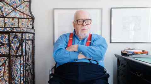 Peter Blake photographed at home in Chiswick, with a drawing by Ben Nicholson to his left and two by David Hockney above him