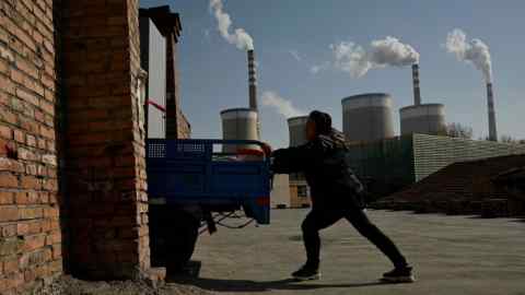 A coal-powered power station belches smoke in Datong, China