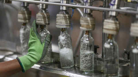 Vodka bottles lined up at a Diageo plant in India