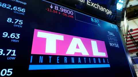 The logo for China’s TAL Education Group above a trading post on the floor of the New York Stock Exchange