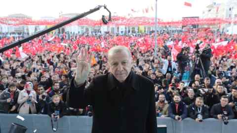 Turkish President Recep Tayyip Erdogan poses for a photo with the crowd during a mass opening ceremony in Konya
