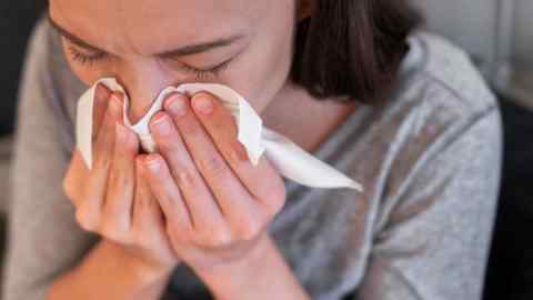 woman feeling unwell at home