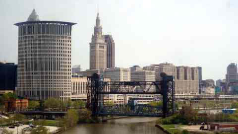 Cleveland skyline of mid-rise and high-rise buildings lining a river