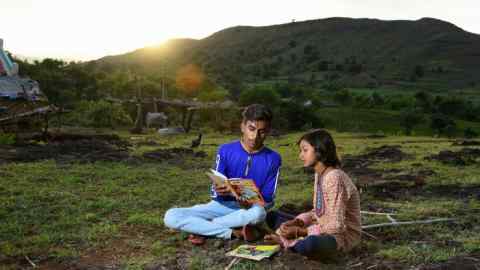 Kirma reads with her Uncle Rikesh Chauhan