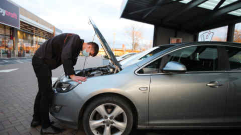 Servicing a car at Halfords in Rugby, UK.