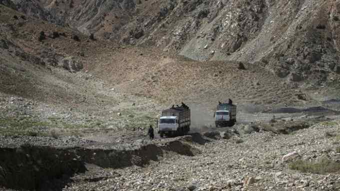 Coal trucks on their way to Pakistan from  the Chinarak mine in Baghlan