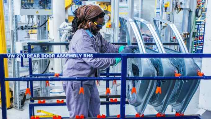 A worker on a VW production line in South Africa, where fintech Moove is now offering a vehicle financing service