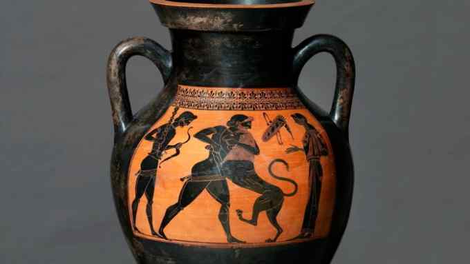 A large black ceramic vase shows Herakles wrestling a lion in black in an orange band