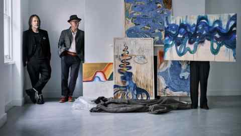 Thom Yorke (left) and Stanley Donwood in the exhibition space at Cromwell Place, with (from left) their artworks Frozen Raw, Beginning Without End, Membranes, Besuch, and One of Many, all 2022