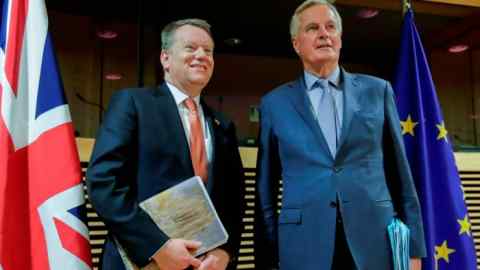 UK chief Brexit negotiator David Frost, left, with his EU counterpart Michel Barnier in Brussels in March. The UK must request any extension to the transition period by the end of June