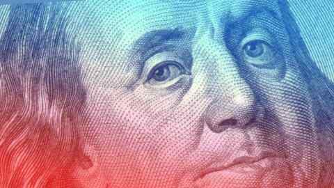 A close-up of a $100 bill