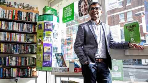 Danny Sriskandarajah, chief executive of Oxfam GB. Photographed in an Oxfam library shop in Balham, London. Portraits by Richard Cannon for the Financial Times