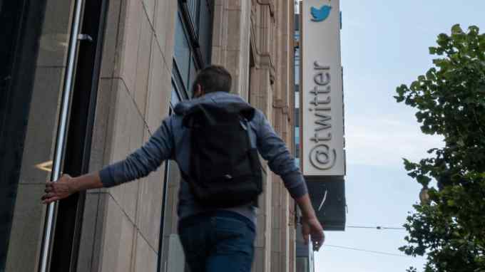 A pedestrian outside Twitter headquarters in San Francisco