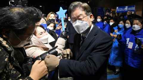 South Korean presidential candidate Lee Jae-myung of the ruling Democratic Party greeting supporters