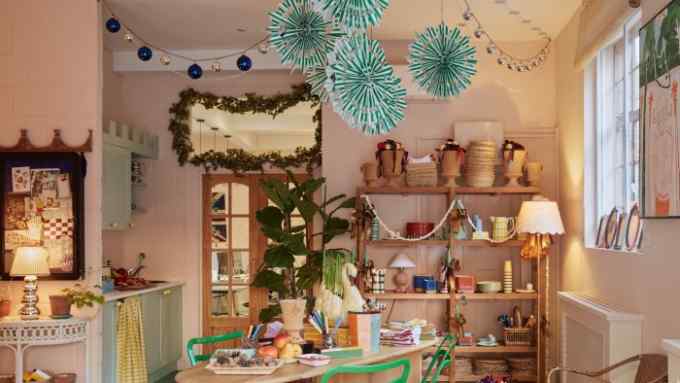 Paper snowflakes hang from the ceiling in Matilda Goad’s shop/studio