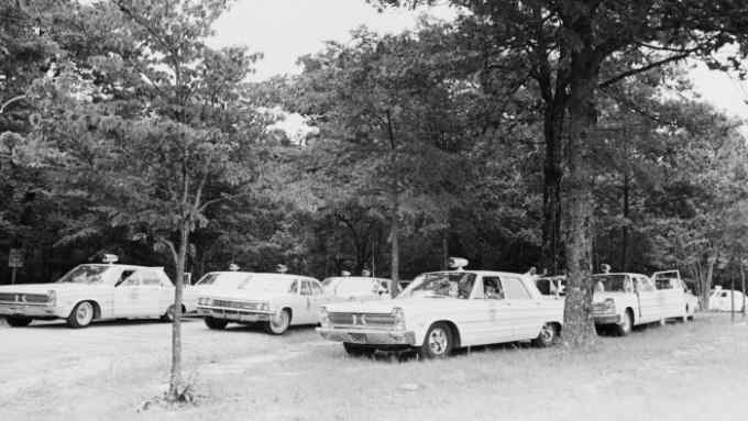 Police cars parked on Highway 51 during the 220-mile March Against Fear from Memphis, Tennessee, to Jackson, Mississippi, in June 1966. The marchers were protesting against racism in the Mississippi Delta