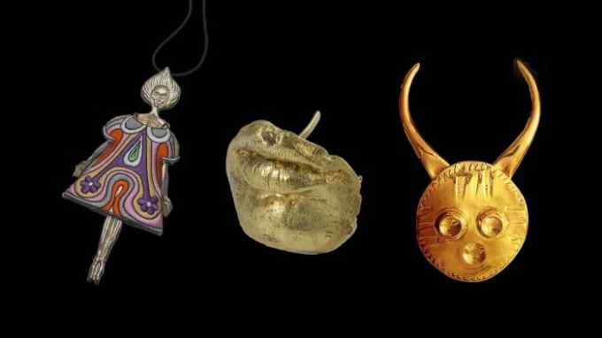 Three items: a doll-shaped pendant; golden cast of a woman’s lips and chin; a golden circle with horns