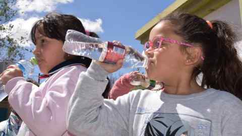 Schoolchildren drinking water