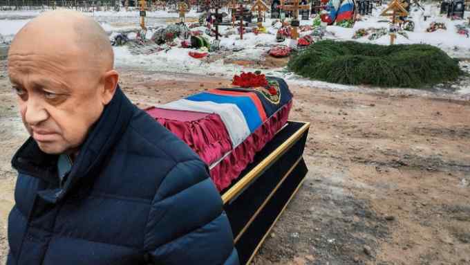 Yevgeny Prigozhin attends the funeral of a Wagner fighter who died in Ukraine