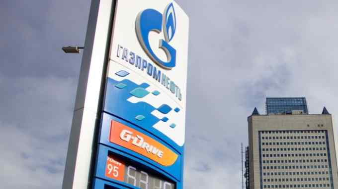 A Gazprom Neft filling station is seen next to the Gazprom Headquarters building in Moscow