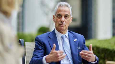 Rahm Emanuel gestures during an interview