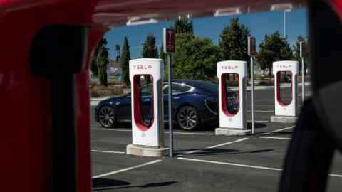 A Tesla vehicle-charging station in Petaluma, California. The carmaker is the latest consumer-facing company to venture into cryptocurrency markets, following PayPal