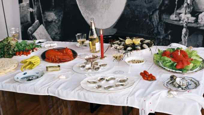 Laila Gohar’s oyster party spread, with oysters, steamed lobster, razor clams – and a lobster-shaped orange blossom cake (at top)