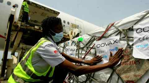 A shipment of Covid vaccines distributed through Covax arrives in Abidjan, Ivory Coast