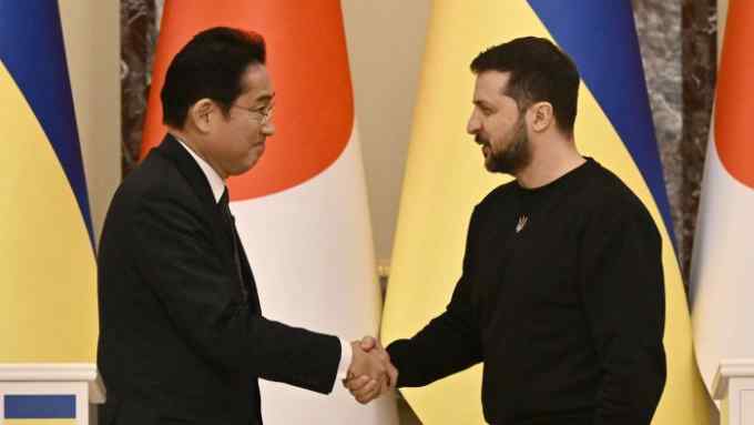Japanese Prime Minister Fumio Kishida and Ukrainian President Volodymyr Zelenskyy, right, greet each other after joint press conference in Kyiv, Ukraine, on March 21, 2023