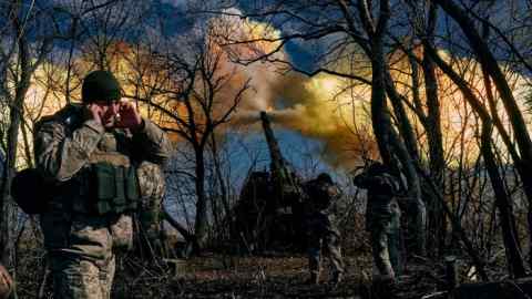 Ukrainian soldiers fire a self-propelled howitzer towards Russian positions near Bakhmut, Ukraine