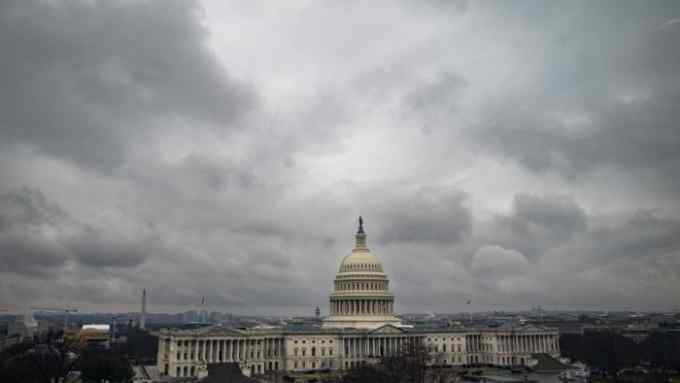 The US Capitol against a cloudy sky