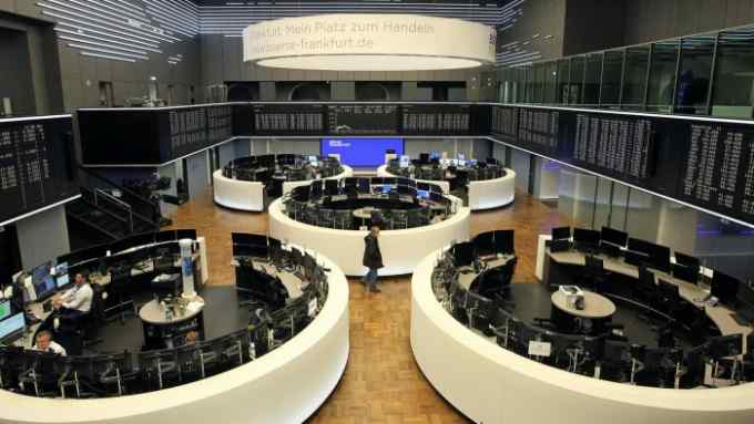 Traders work at the stock exchange in Frankfurt, Germany, on February 24 2022