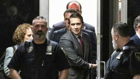 Todd Blanche, centre, arrives at criminal court in New York on April 4