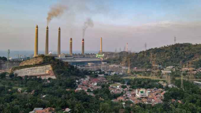 smoke rises from the chimneys at the Suralaya coal power plant in Cilegon