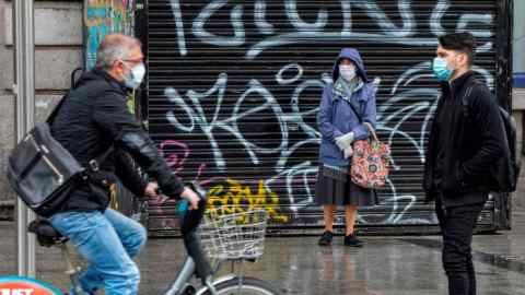 Pedestrians and cyclists in Dublin. Ireland is facing its worst-ever recession