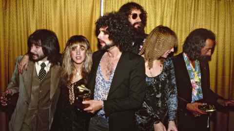 Fleetwood Mac members celebrate a win at the 1978 Grammys