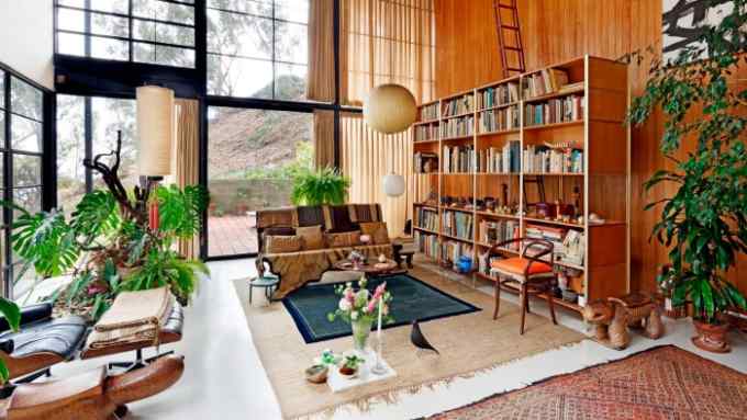 wood and glass modernist interior of Eames House living room