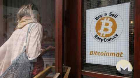 A sign for Bitcoin in the window of a YMCA building in Prague, Czech Republic, on Tuesday, May 17 2022