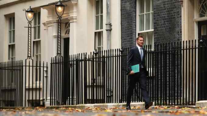 Chancellor Jeremy Hunt, walking in Downing Street, London