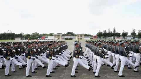 Taiwanese cadets march during the Republic of China Military Academy centennial celebrations in Kaohsiung, Taiwan on Saturday