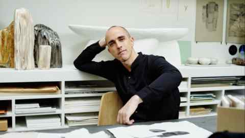 Interior designer Raphael Navot at his desk at home