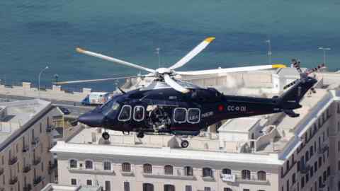 A police helicopter on patrol above the city of Bari