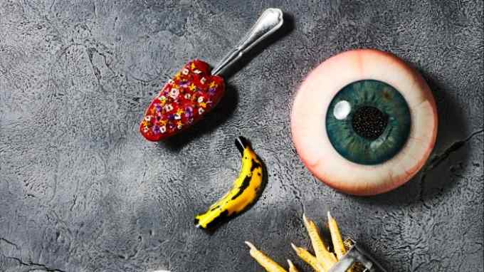 A selection of dishes at Alchemist, including a lollipop in the shape of a tongue, replicas of a human eye and Andy Warhol’s banana, and chicken feet in a fries tin