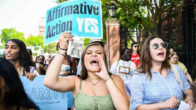 Participants march and chant slogans at a rally protesting the Supreme Court’s ruling against affirmative action on Harvard University Campus in Cambridge, Massachusetts