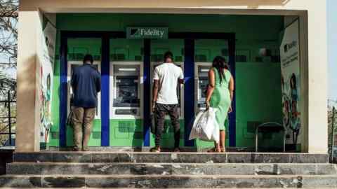 Customers at a retail bank in Abuja