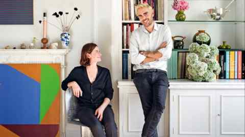 Simone Gooch with Oscar Humphries in his London home, with flowers by Gooch