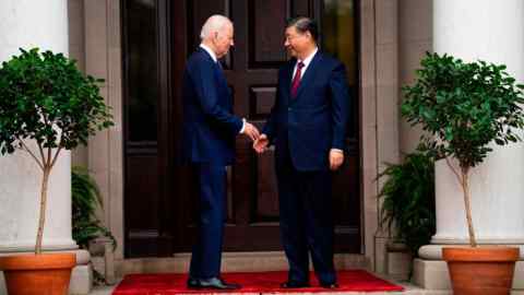 President Joe Biden greets China’s President Xi Jinping